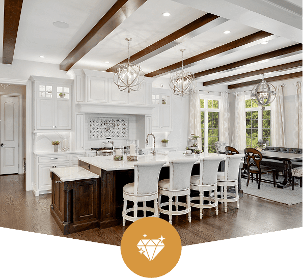 Modern kitchen with island and wooden beams.